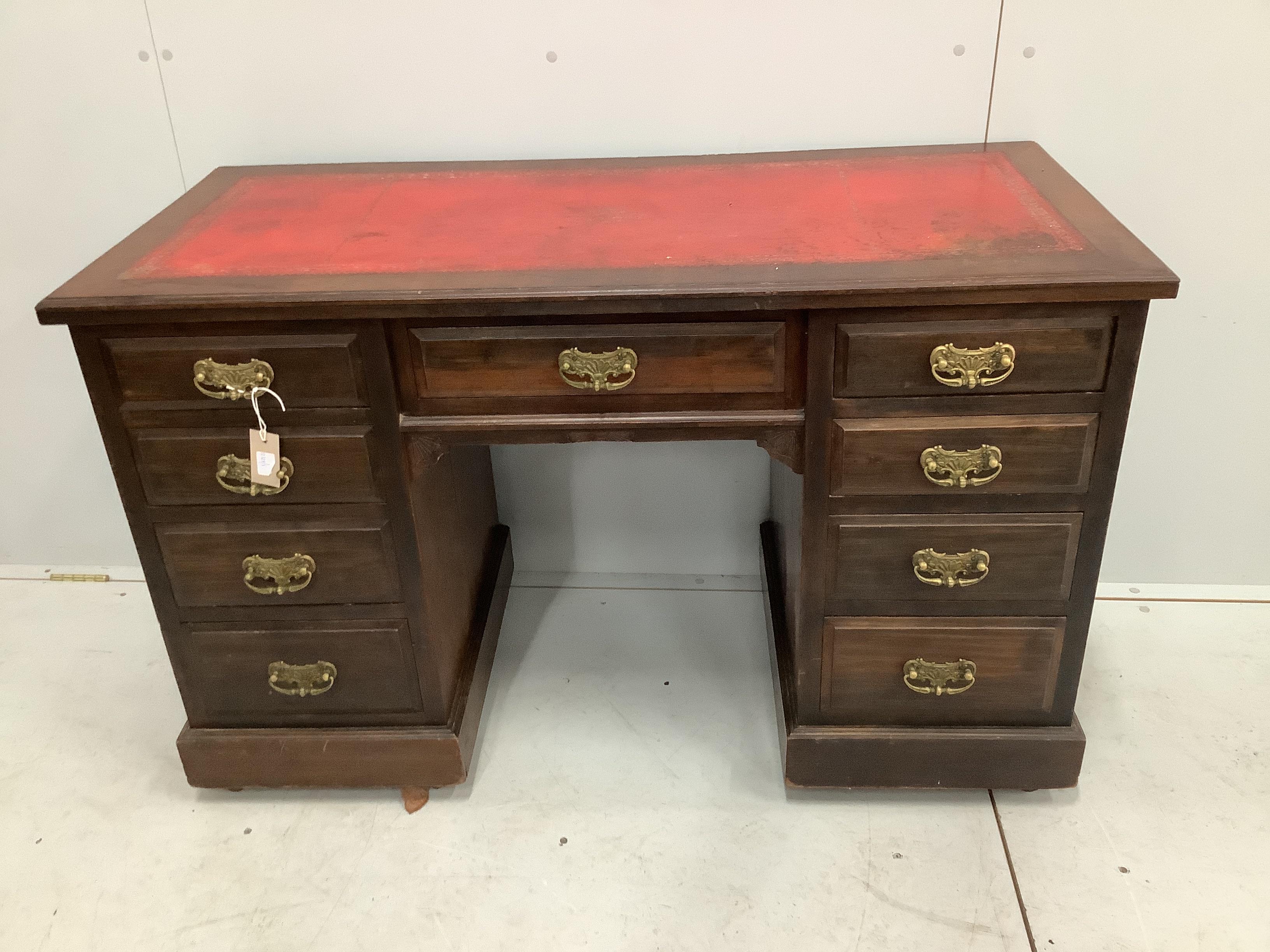 A late Victorian mahogany kneehole writing desk, width 122cm, depth 54cm, height 76cm